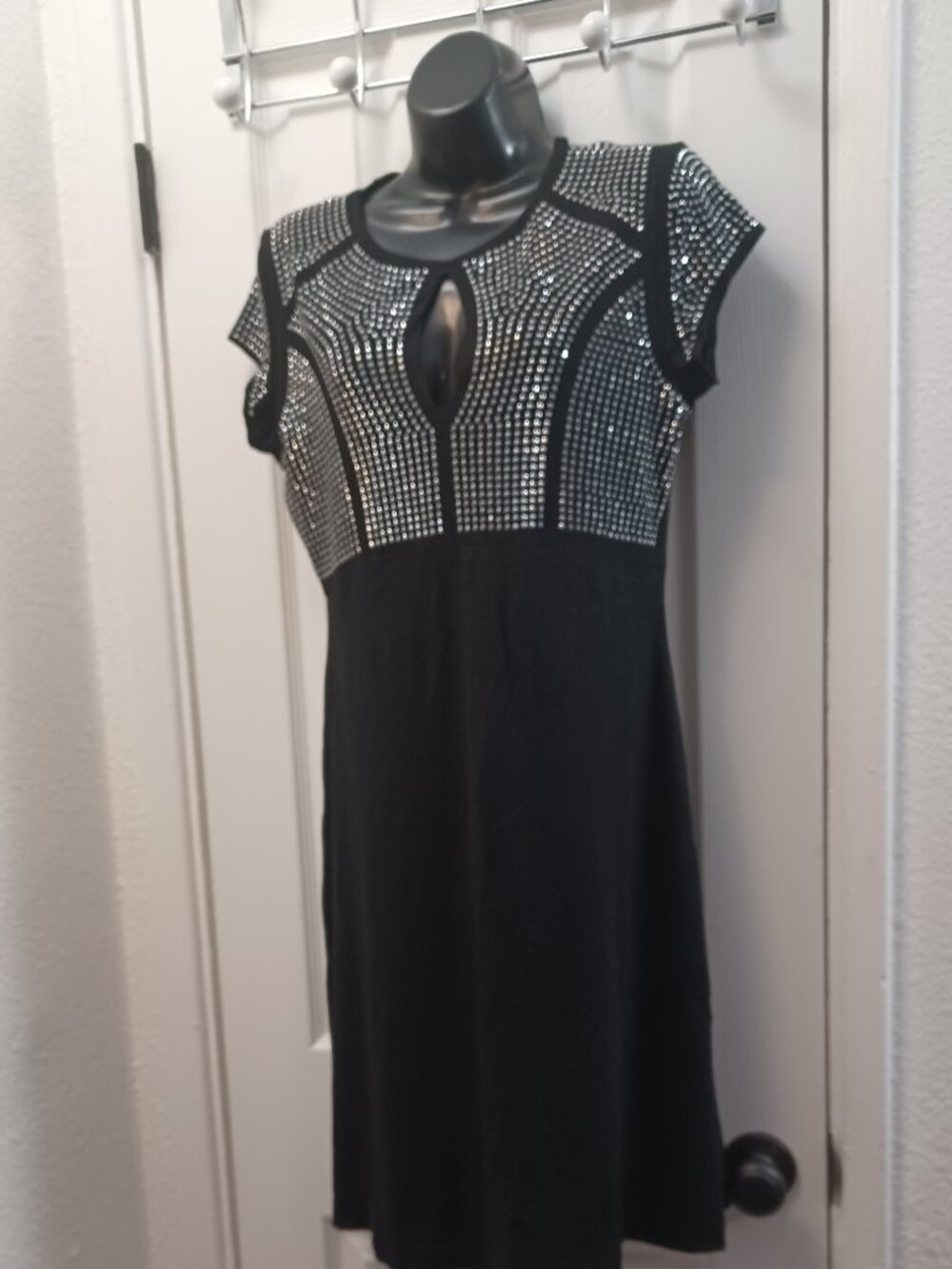 Black dress with silver studs in a grid pattern fit and flare baby doll dress